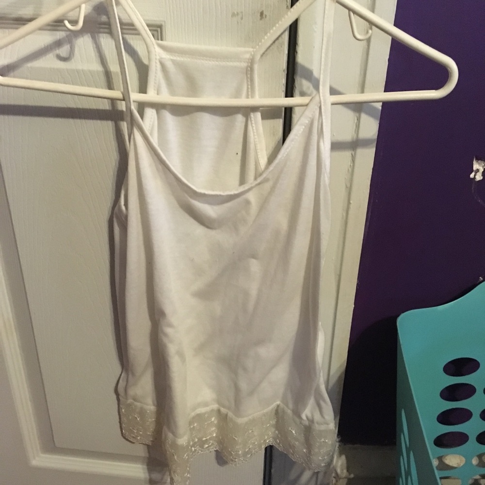 Cream tank top with lace trimming at bottom